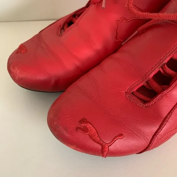 Hold Vintage Puma Ferrari racing shoes
