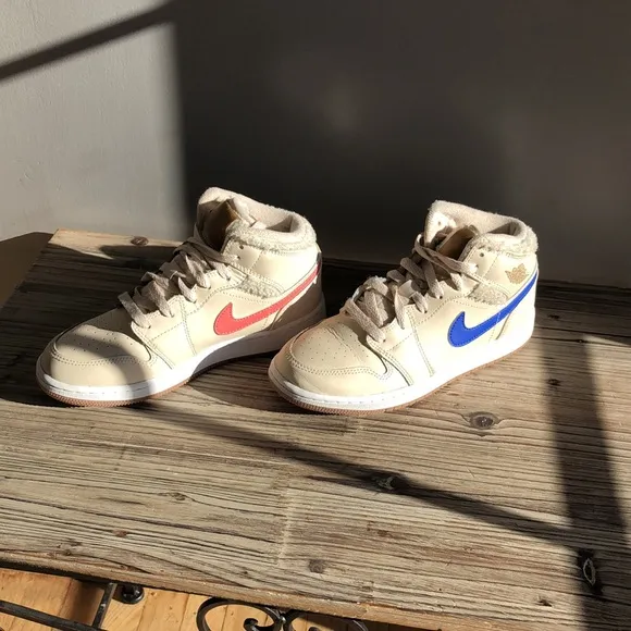 Kids Jordan’s 4.5Y they are beige with all check marks different colors.