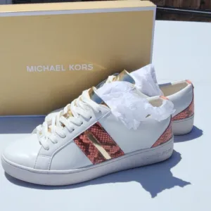 Michael Kors Peach size 7M Catelyn Stripe snakeskin tennis shoes. Used good