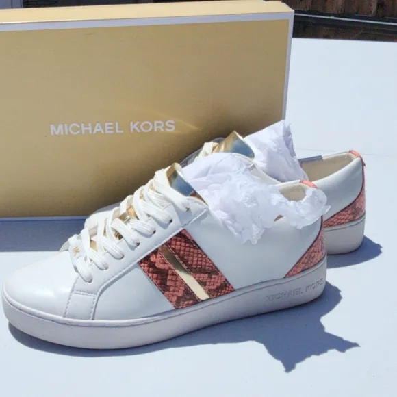 Michael Kors Peach size 7M Catelyn Stripe snakeskin tennis shoes. Used good