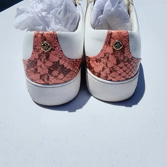 Michael Kors Peach size 7M Catelyn Stripe snakeskin tennis shoes. Used good