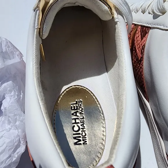 Michael Kors Peach size 7M Catelyn Stripe snakeskin tennis shoes. Used good