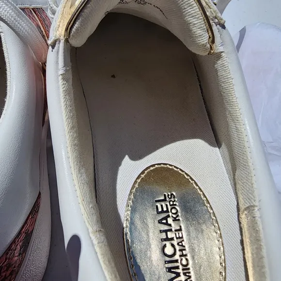 Michael Kors Peach size 7M Catelyn Stripe snakeskin tennis shoes. Used good