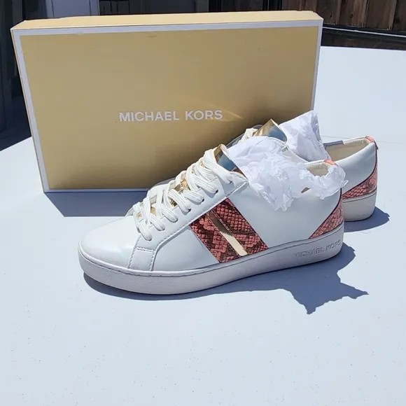 Michael Kors Peach size 7M Catelyn Stripe snakeskin tennis shoes. Used good