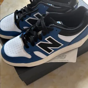 New Balance kids Blue and White Sneakers