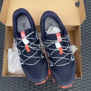 Salomon Navy and Coral Trail Running Shoes