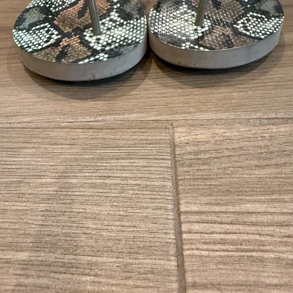 Tory Burch- snakeskin flip flop sandals